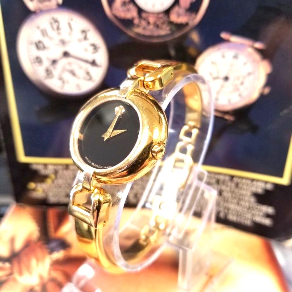 SOLD!!!!!!!MOVADO VIVO 27MM
QUARTZ BLACK DIAL GOLD
BANGLE WOMEN'S WATCH
0605638